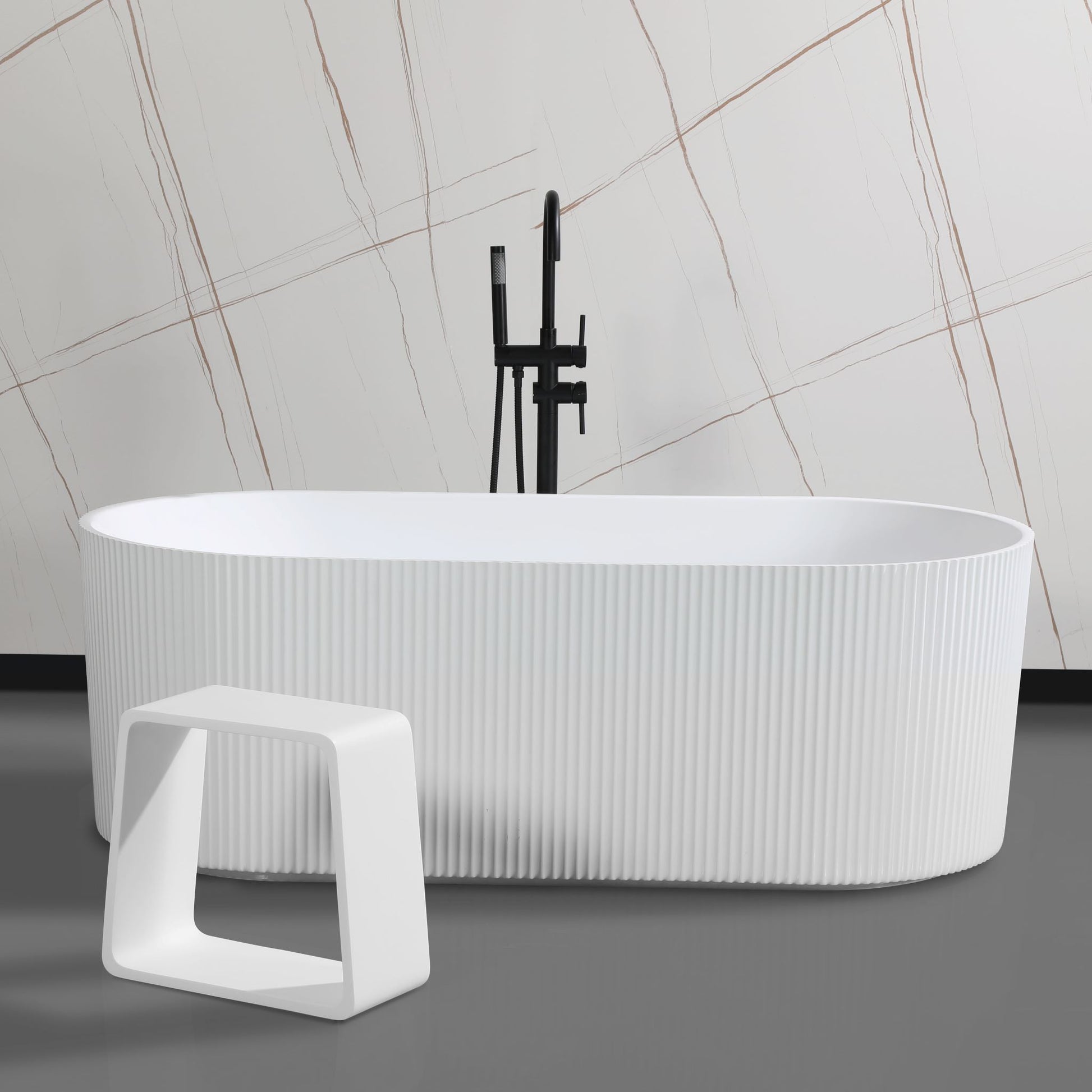 ALFI Brand White freestanding bathtub with a modern design and a bathroom stool in a bathroom setting. - Luxe Tub Source
