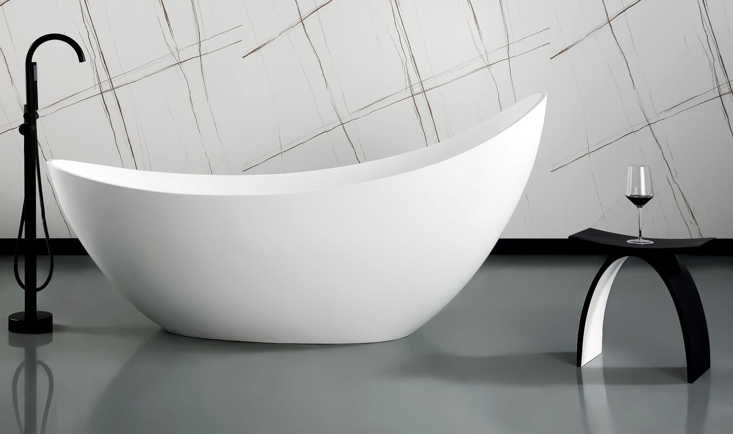 ALFI Brand Modern white freestanding bathtub and modern bathroom stool in a bathroom with a geometric wall design. - Luxe Tub Source