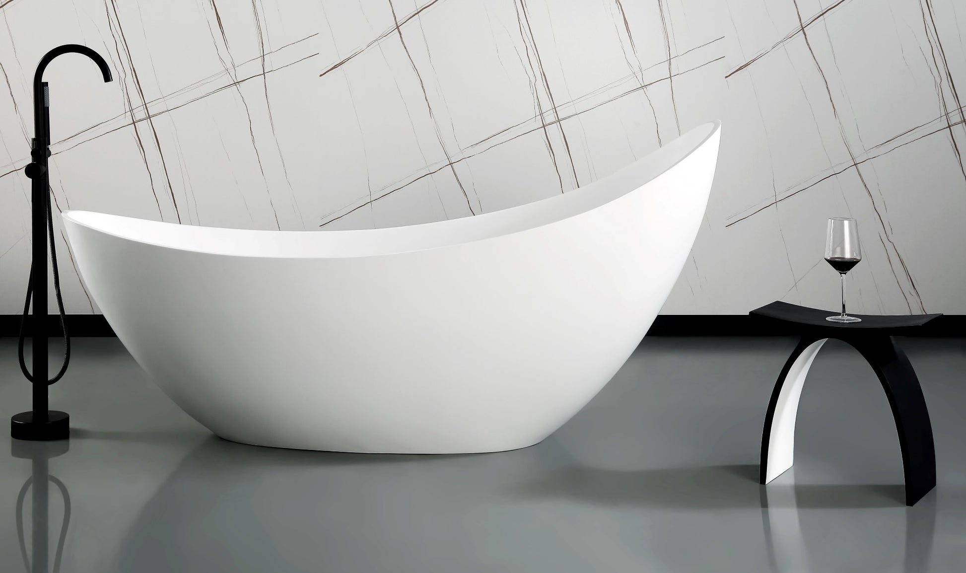 ALFI Brand Modern white freestanding bathtub and modern bathroom stool in a bathroom with a geometric wall design. - Luxe Tub Source