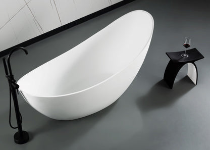 ALFI Brand Modern freestanding bathtub in a bathroom setting with a glass of wine on a stool. - Luxe Tub Source