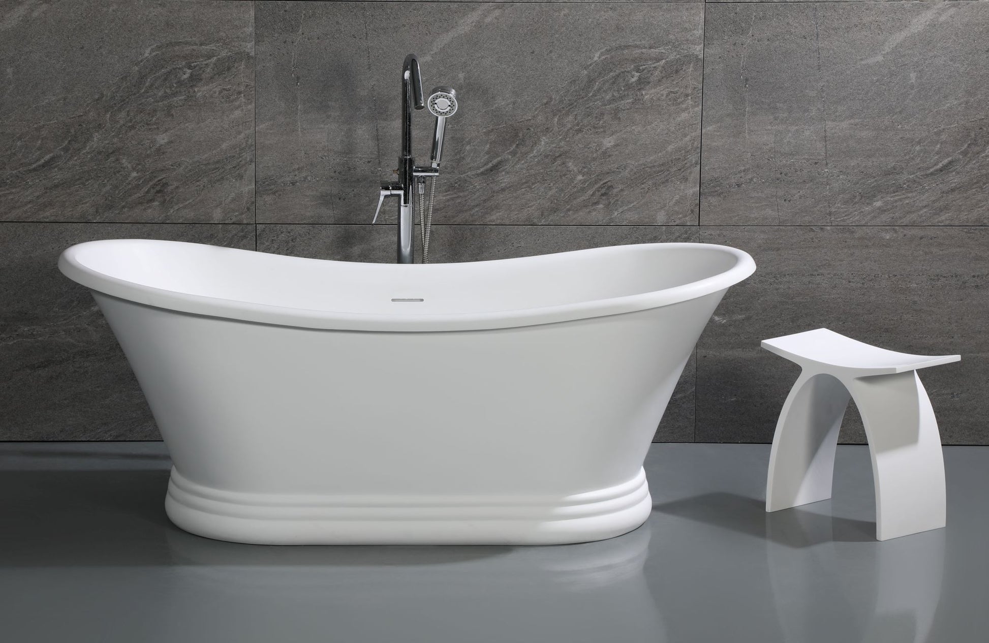 ALFI Brand White freestanding bathtub with a bathroom stool against a gray tiled wall. - Luxe Tub Source