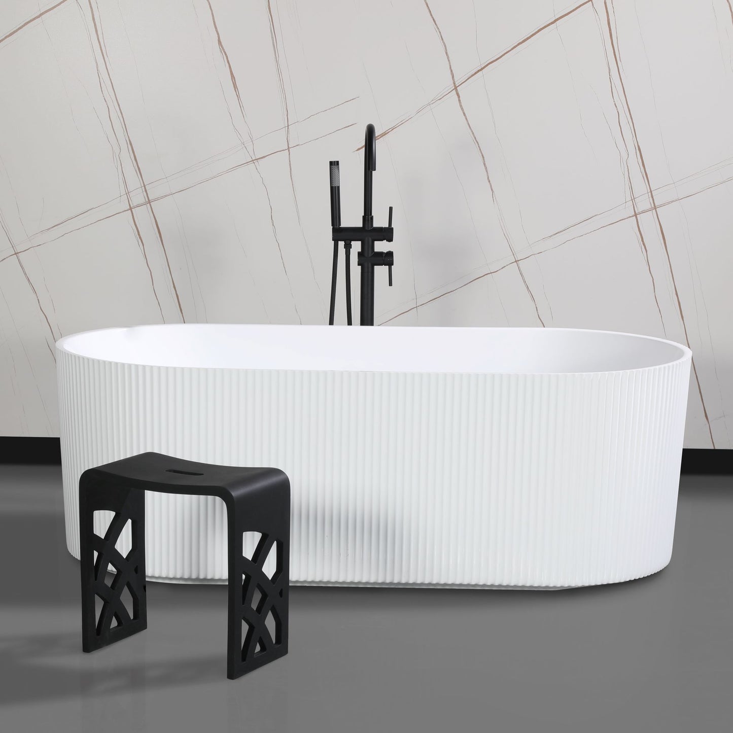 ALFI Brand White freestanding bathtub with a black stool and shower head against a tiled wall. - Luxe Tub Source