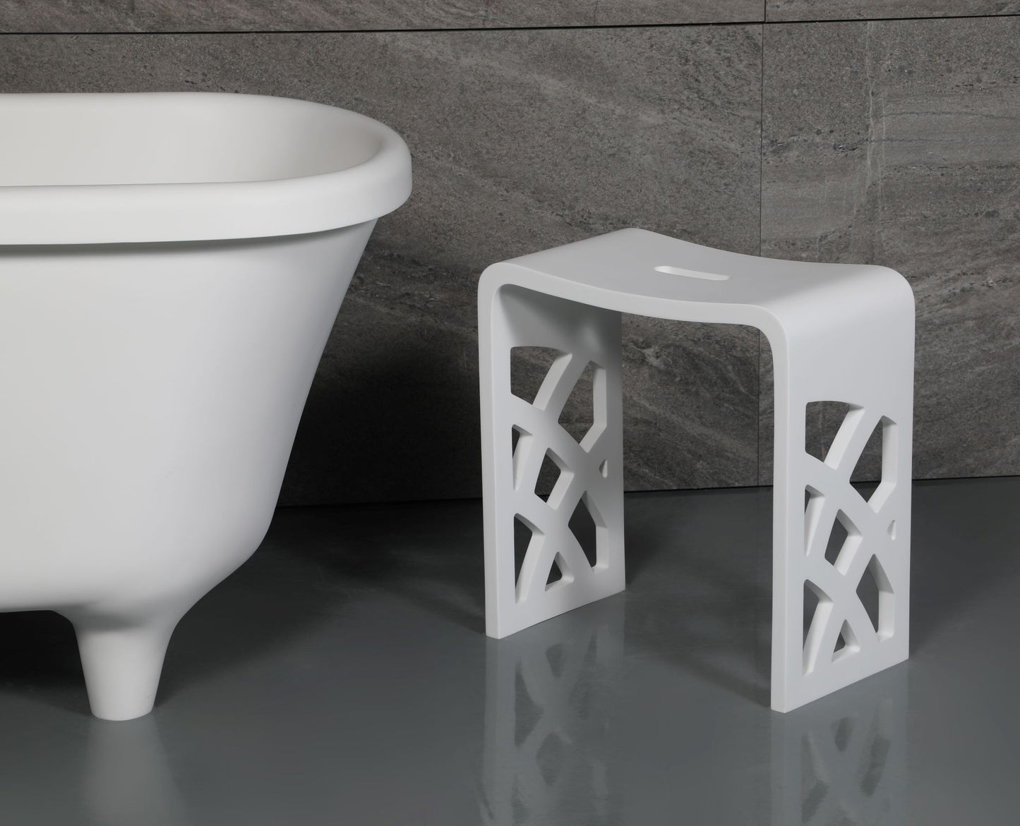 ALFI Brand White lattice-patterned stool next to a freestanding bathtub in a bathroom setting. - Luxe Tub Source