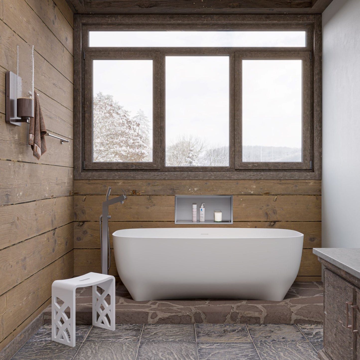 ALFI Brand Modern bathroom with a freestanding bathtub and white stool in a wooden cabin setting. - Luxe Tub Source