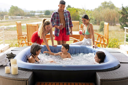 MSpa Family enjoying a hot tub outdoors with a scenic background.  - Luxe Tub Source