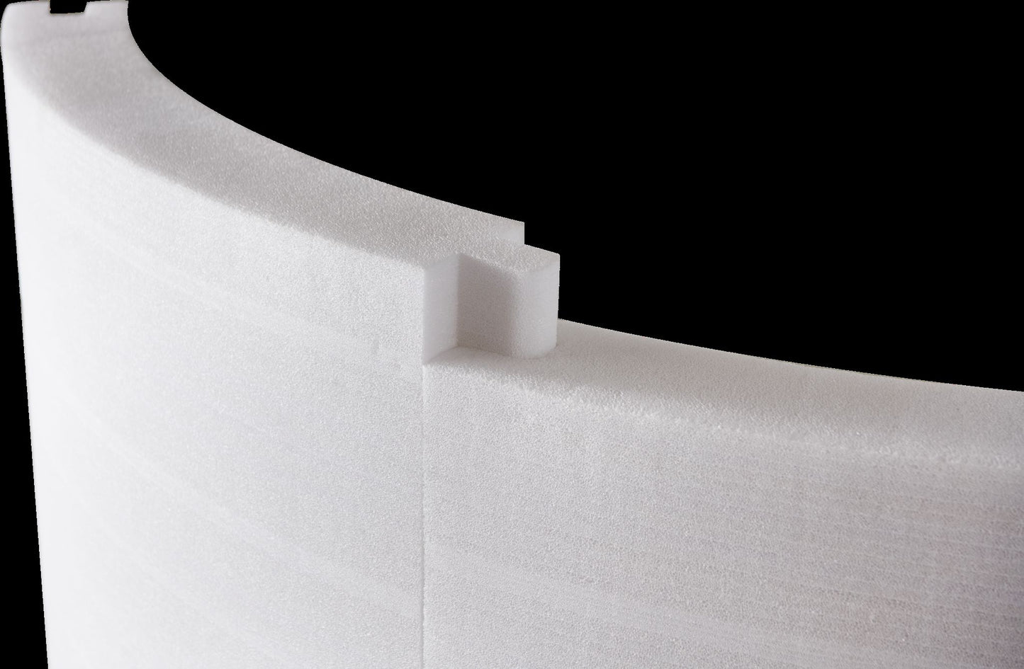 MSpa Close-up of curved white hot tub inserts with a black background. - Luxe Tub Source