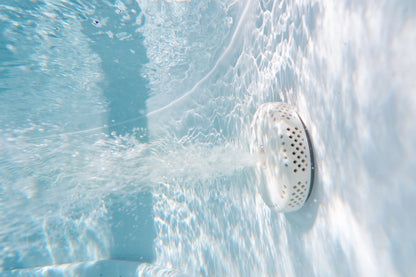 MSpa Close-up of a hot tub jet with water flowing around it. - Luxe Tub Source