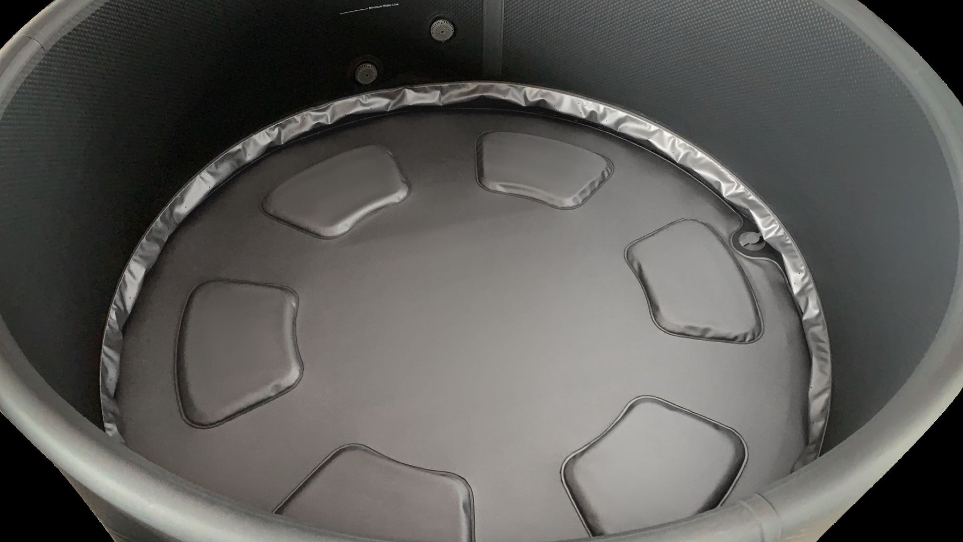 MSpa Close-up of a round hot tub interior. - Luxe Tub Source