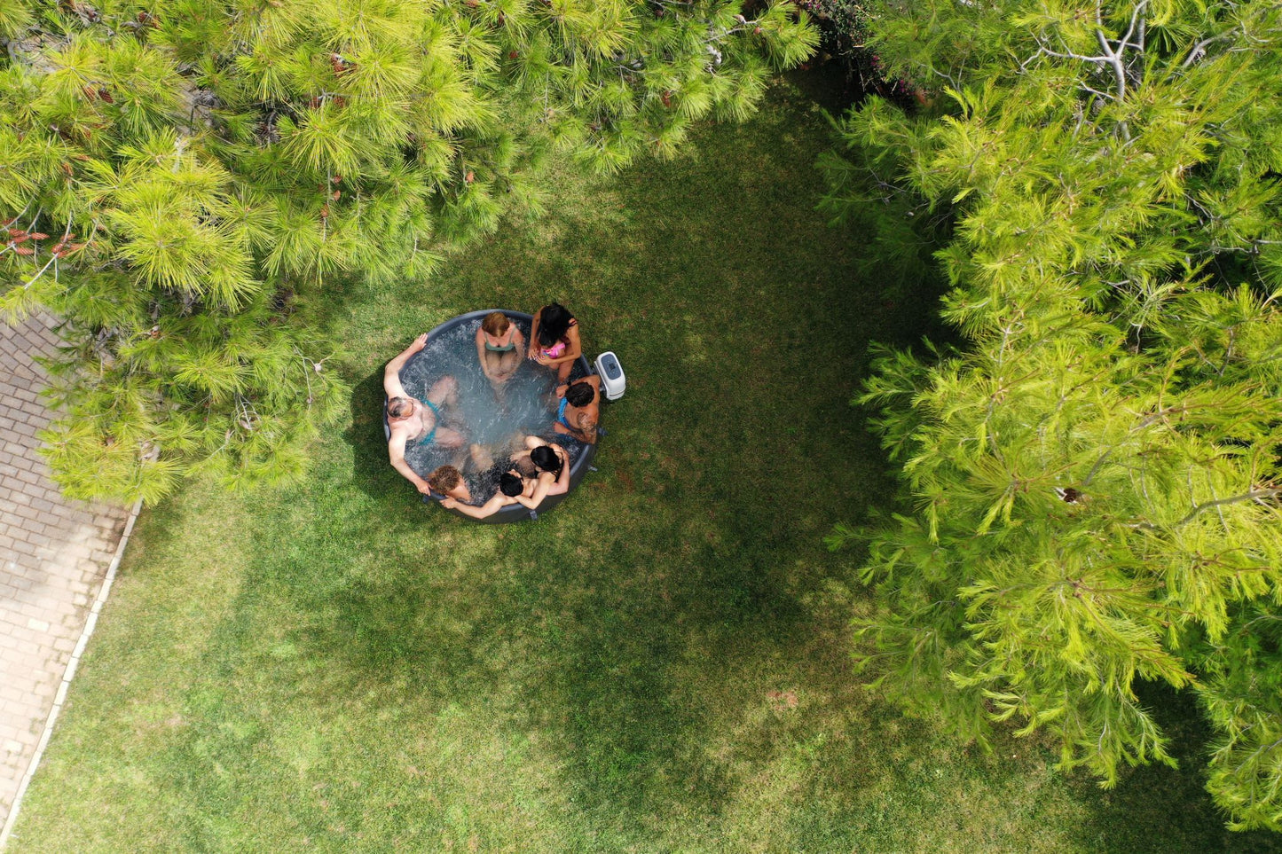 MSpa Aerial view of a hot tub surrounded by greenery. - Luxe Tub Source