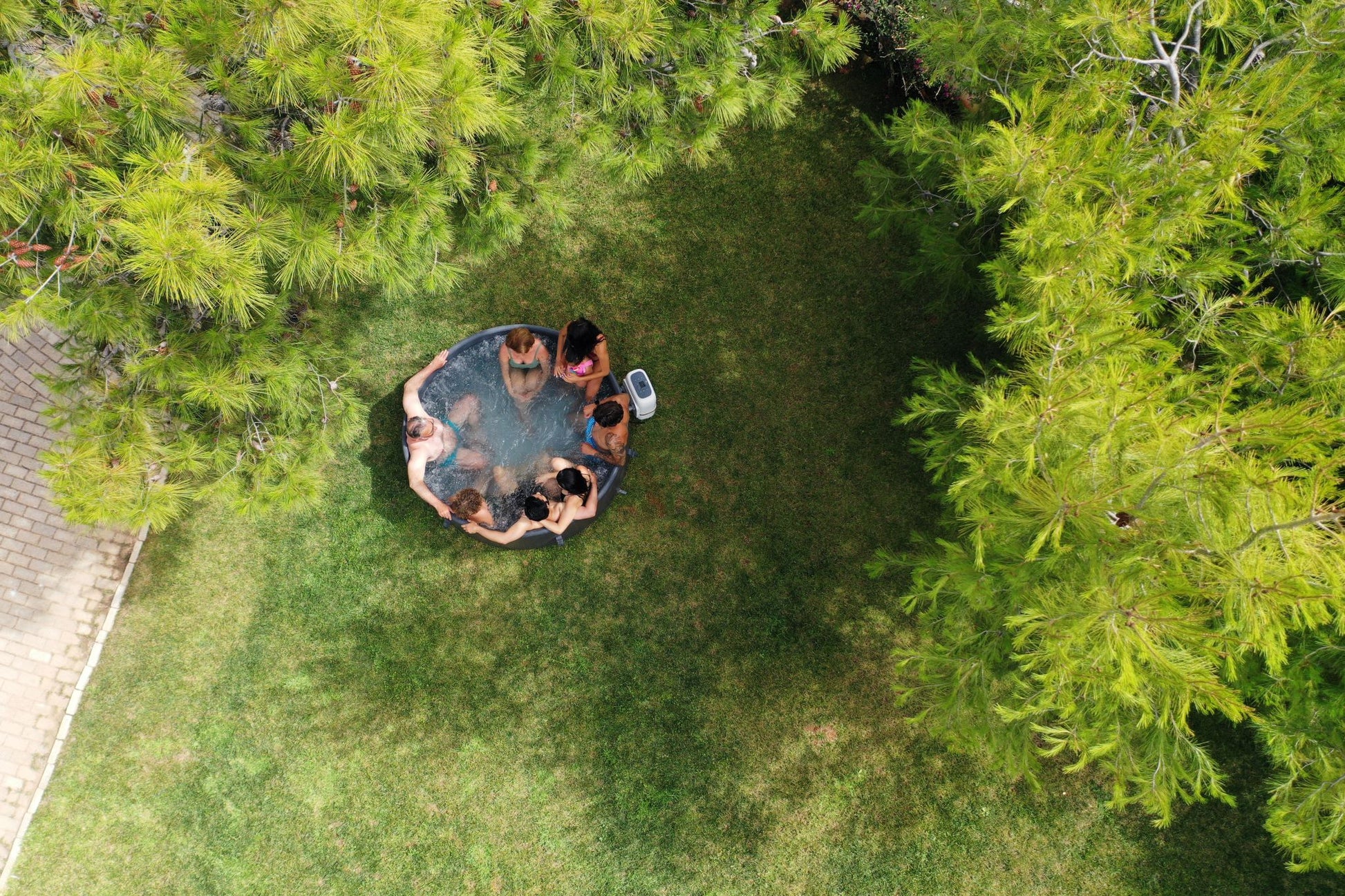 MSpa Aerial view of a hot tub surrounded by greenery. - Luxe Tub Source