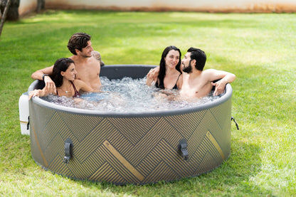 MSpa Group of people in a portable hot tub outdoors on grass. - Luxe Tub Source