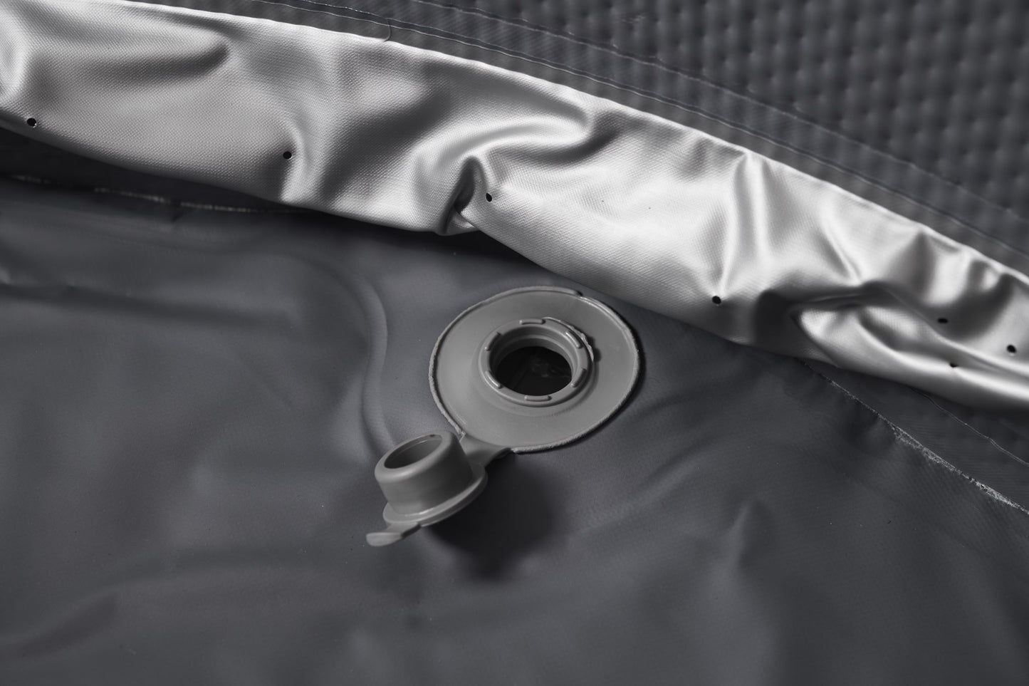 MSpa Gray valve on the interior of an inflatable hot tub. - Luxe Tub Source