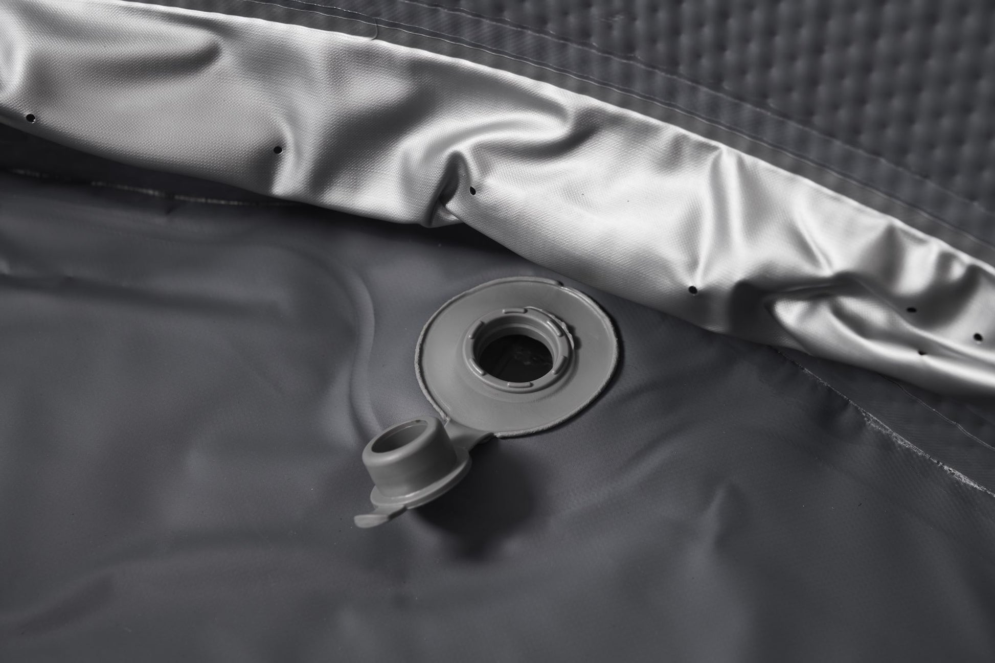 MSpa Gray valve on the interior of an inflatable hot tub. - Luxe Tub Source