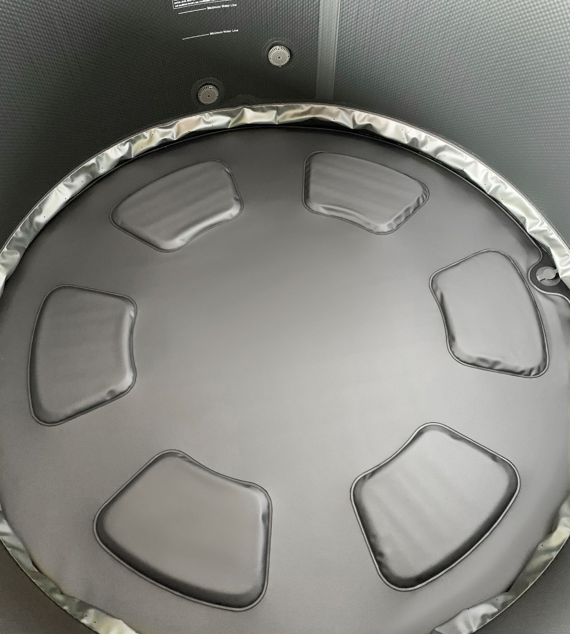 MSpa Top view of a round hot tub with textured interior. - Luxe Tub Source