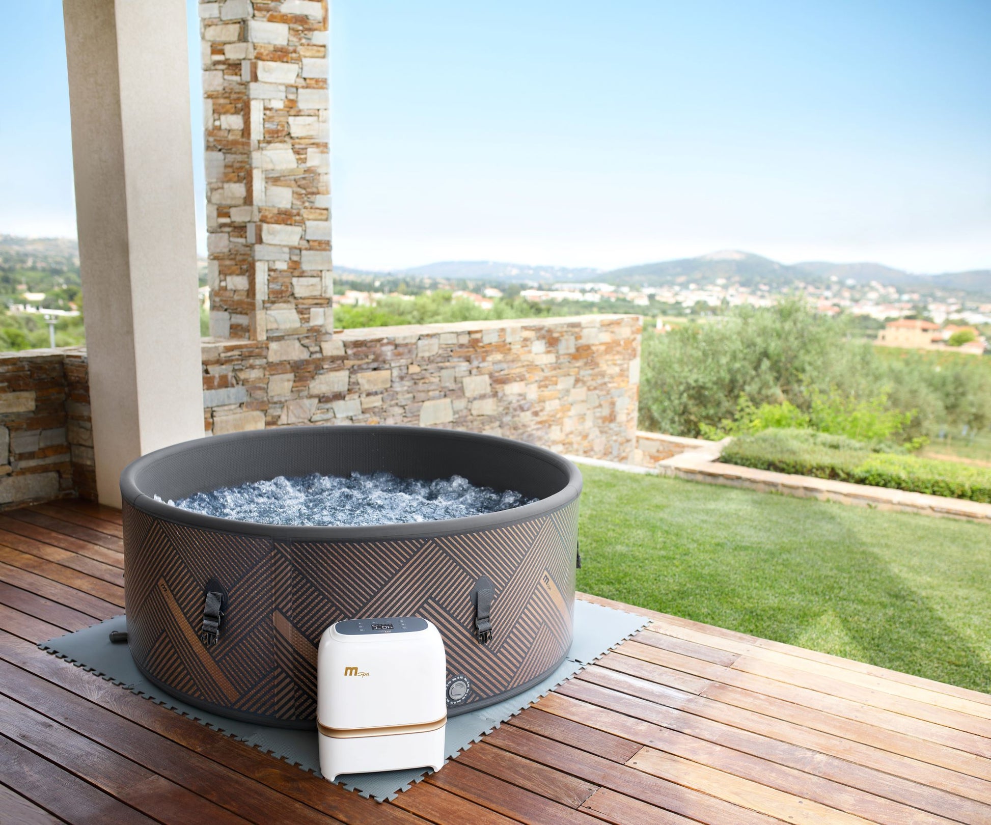 MSpa Hot tub on a wooden deck with a scenic background. - Luxe Tub Source