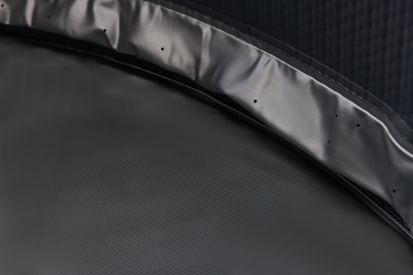 MSpa Close-up of a textured hot tub black surface with a subtle pattern. - Luxe Tub Source