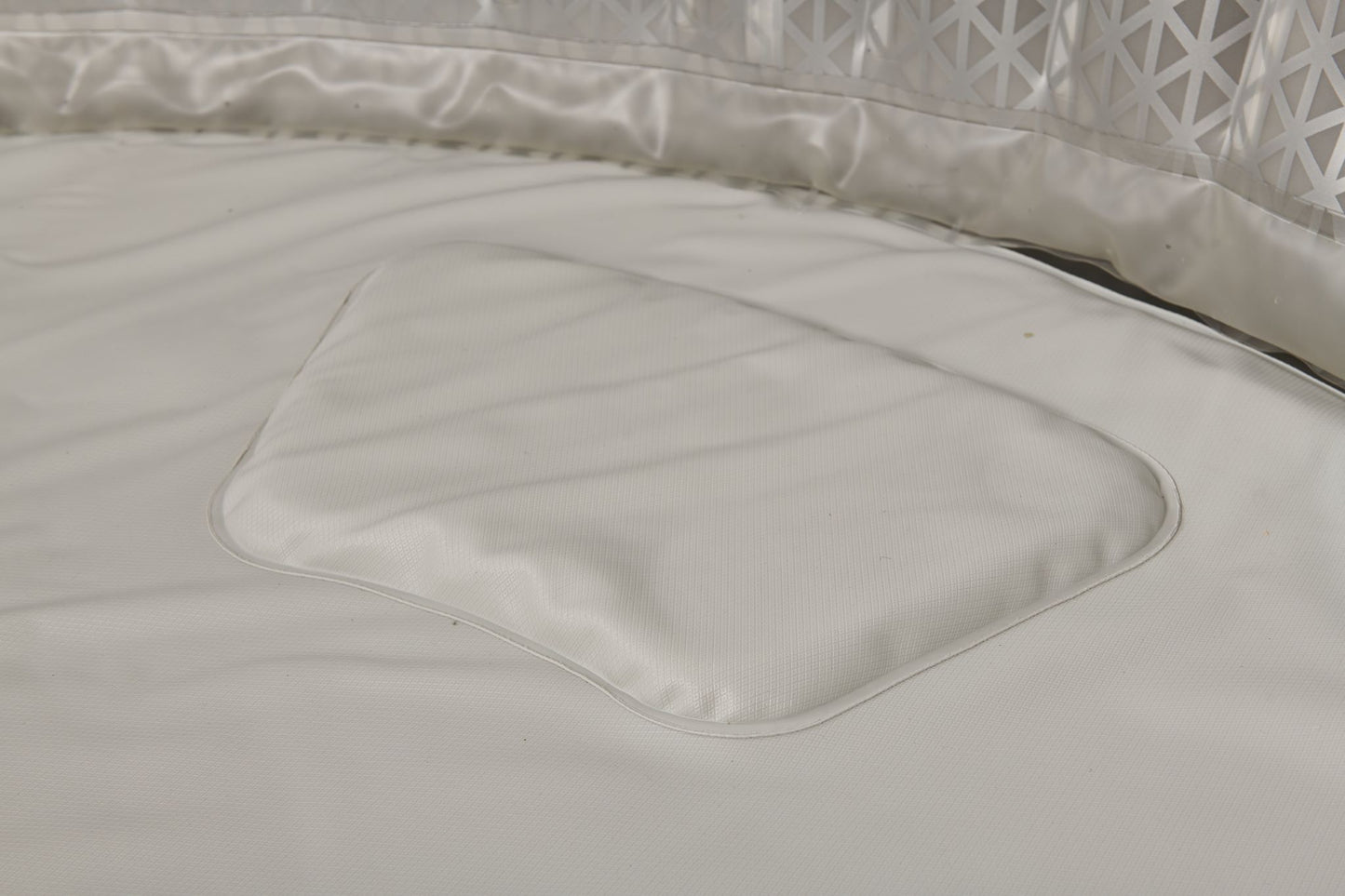 Close-up of the interior of the Mspa Aurora hot tub with a textured surface.