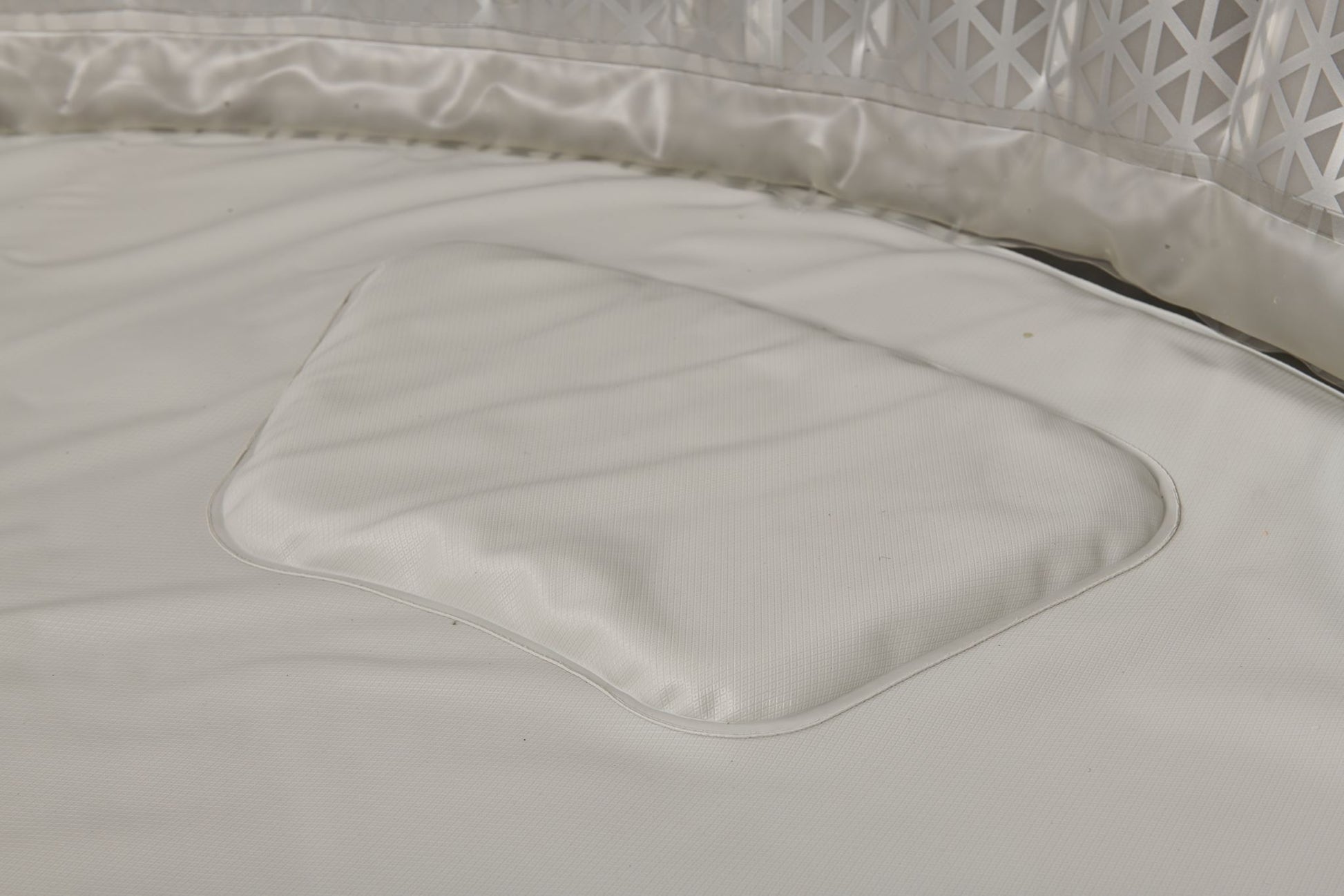 Close-up of the interior of the Mspa Aurora hot tub with a textured surface.