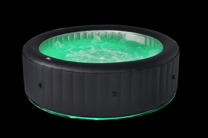 Inflatable hot tub with green water on a black background