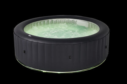 Inflatable hot tub with green water on a black background