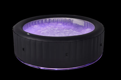 Inflatable hot tub with purple LED lights on a black background