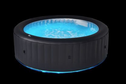 Inflatable hot tub with blue water on a black background